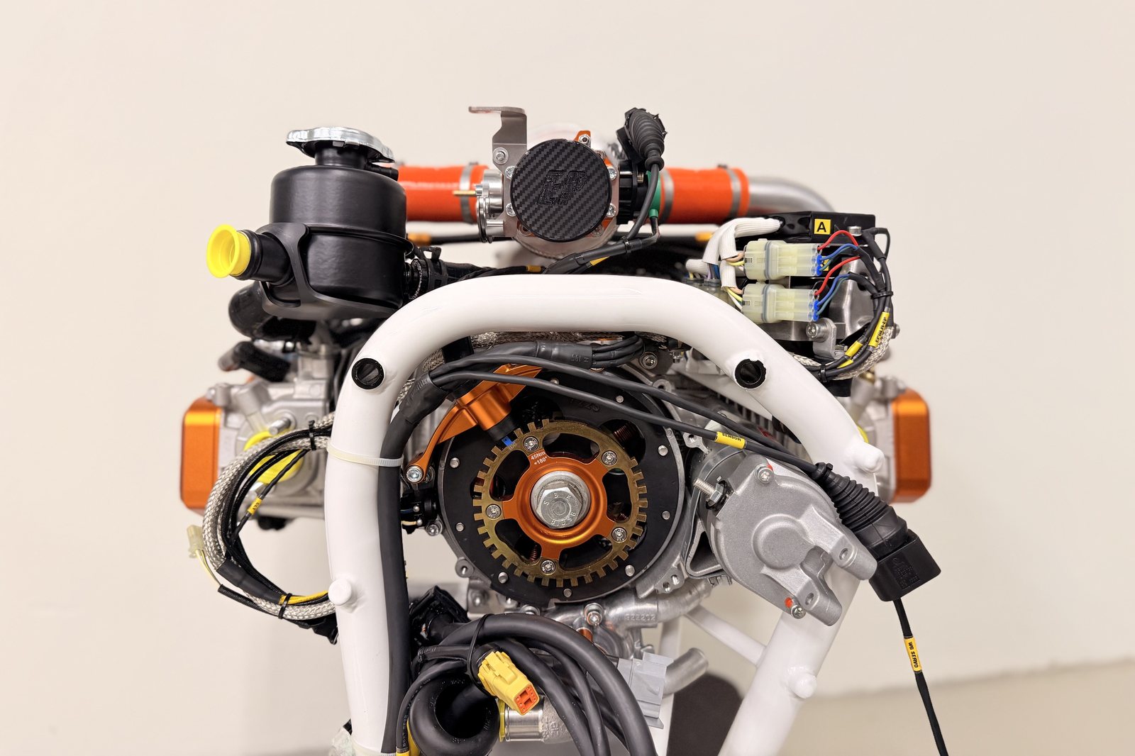 Rear view of a fuel-injected UAV engine showing ignition trigger wheel and ECU wiring