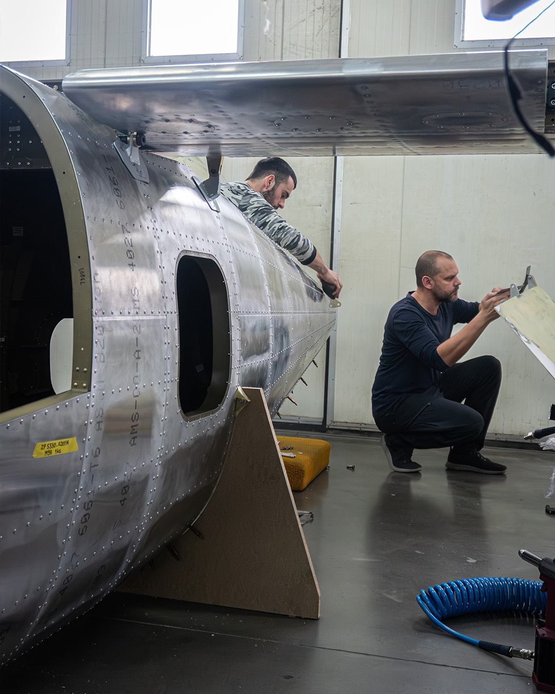 Engineers joining TD 2.0's wing to the fuselage in the Prague workshop