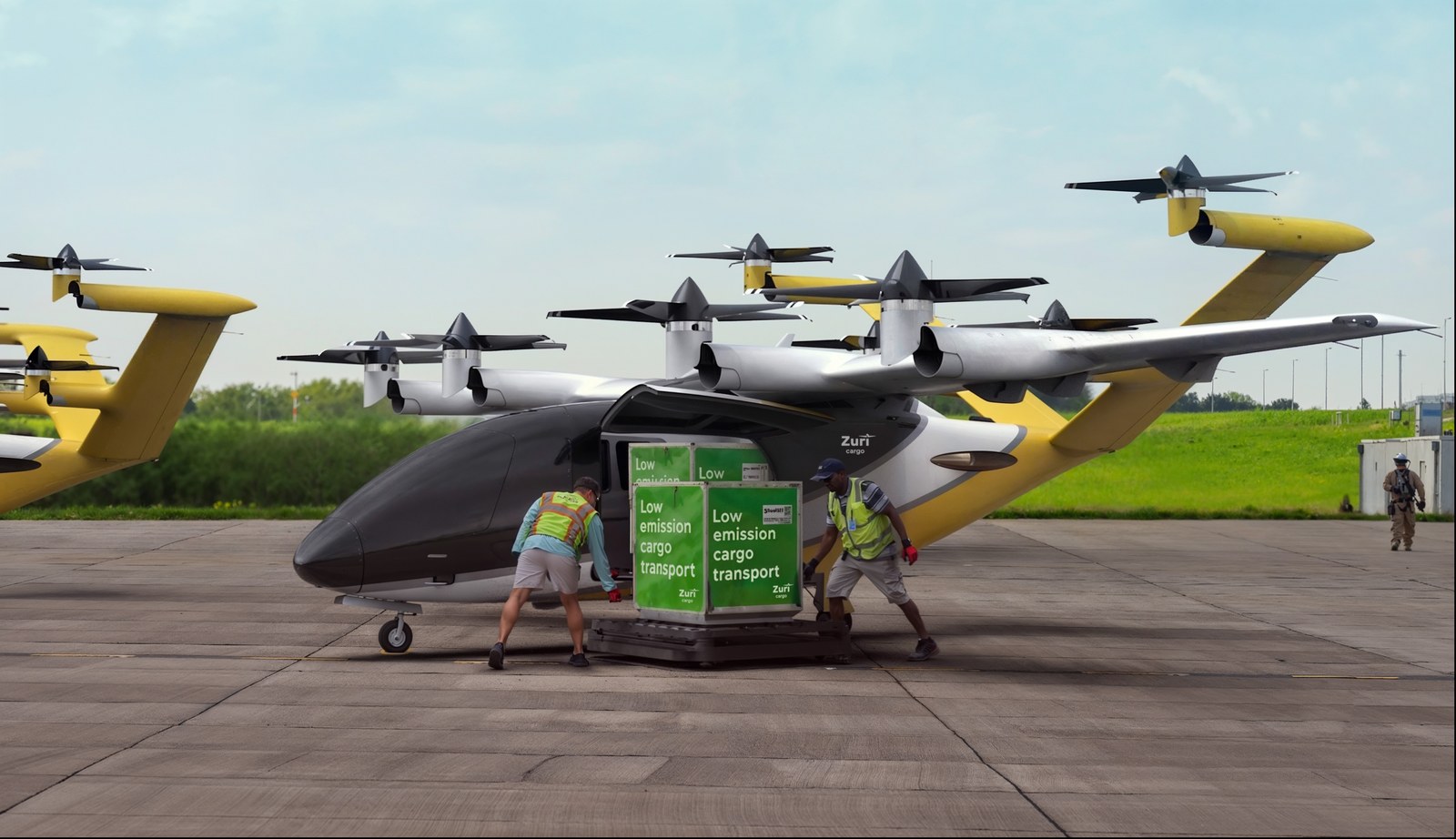 Render of the large cargo variant on an apron, two ground crew pushing a pallet marked low emission cargo transport toward the hold