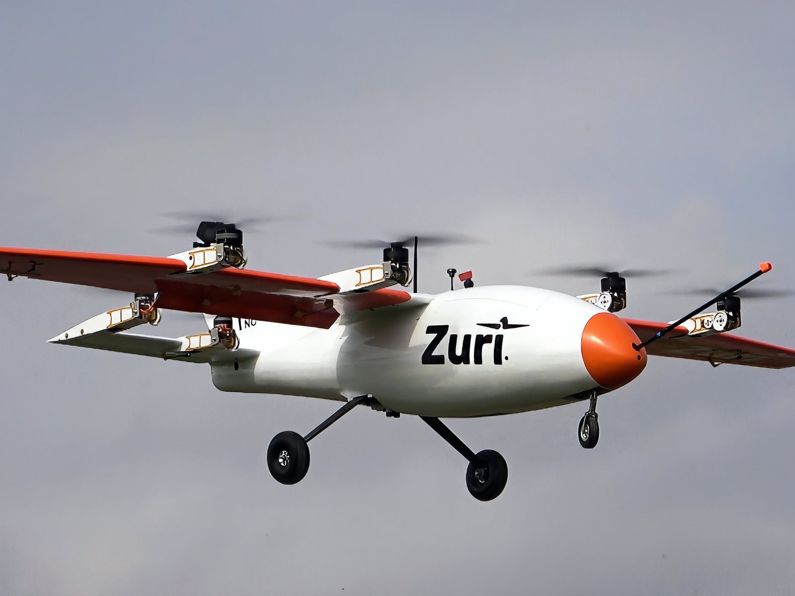 The V1NG subscale model in flight, rotors turning and landing gear down