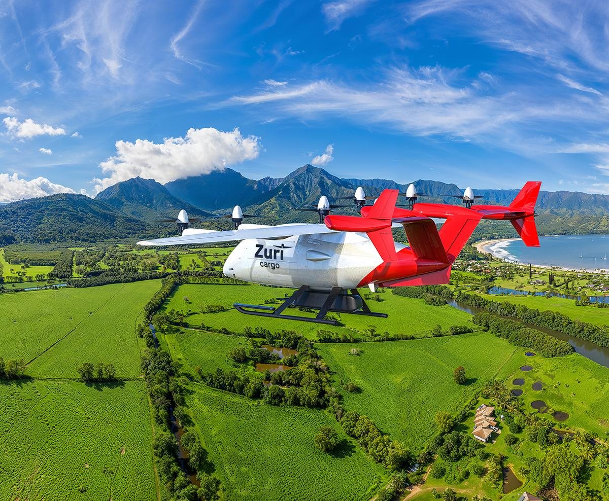 The Zuri uncrewed cargo aircraft in cruise above an island coast, fields and mountains inland, a render