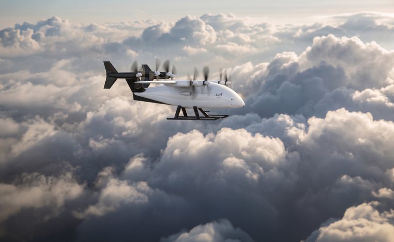 Render of the uncrewed cargo aircraft in wing-borne cruise above a cloud deck