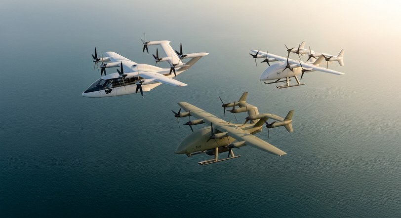 Render of three Zuri aircraft banking over sunlit water: the six-seat passenger aircraft at left with a pilot visible, the white uncrewed cargo aircraft at right, and the olive defense variant below them