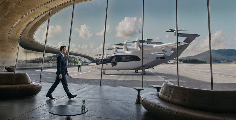 Render of a passenger walking through a terminal toward the six-seat aircraft waiting on the apron beyond the glass