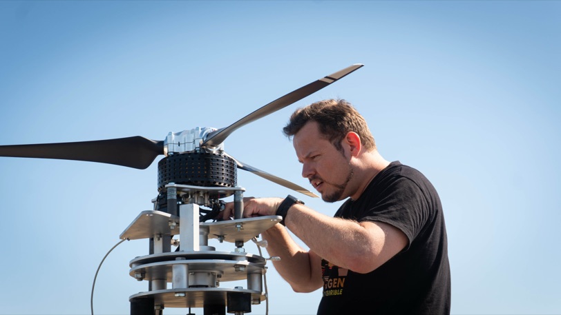 A Zuri engineer fitting a propeller blade to the TD 2.0 propulsion unit on its outdoor test stand