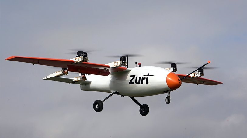 The Zuri V1NG subscale demonstrator in wing-borne cruise against cloud, rotors forward