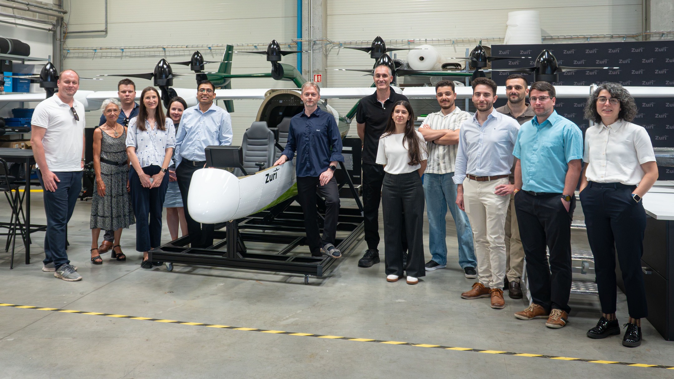 The VITOLMINS project delegation standing with the Zuri team in the Prague production hall