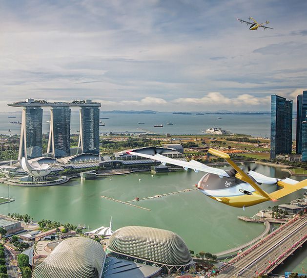 Zuri VTOL aircraft flying above Marina Bay in Singapore, enabling efficient cargo delivery in urban environments.
