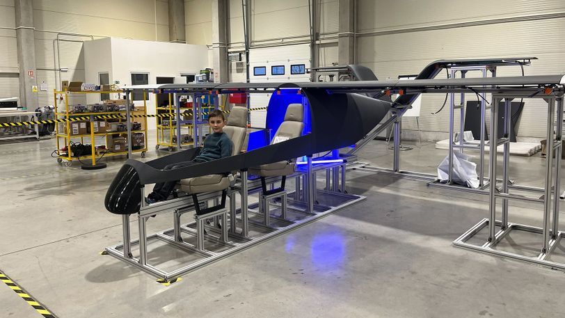 Child sitting inside a Technology Demonstrator 2.0 during Zuri Family Day.